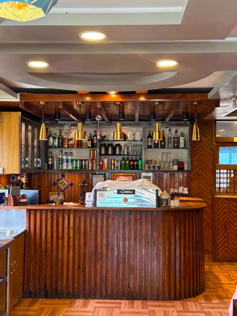 Reception counter with timber finishes and pendant lighting