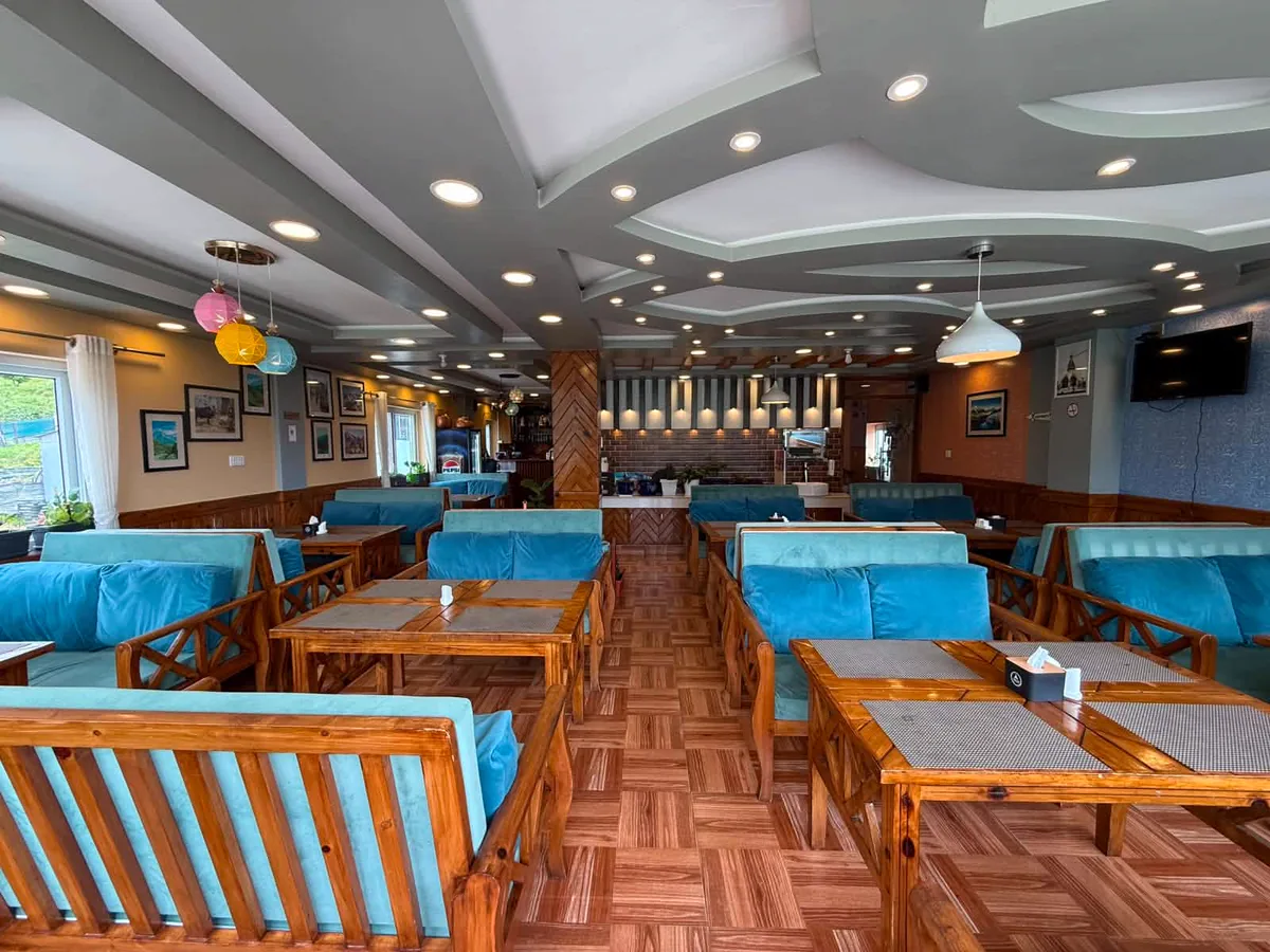 Wide view of the restaurant dining room at The Himalayan Yak Hotel